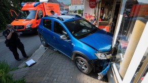 blue-car-crashed-into-storefront