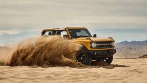 The 2021 Ford Bronco slides through the sand proving its one of the best manual cars available in 2021