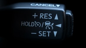 A close-up of a black cruise control stalk in a 2016 Lexus RX 350 SUV