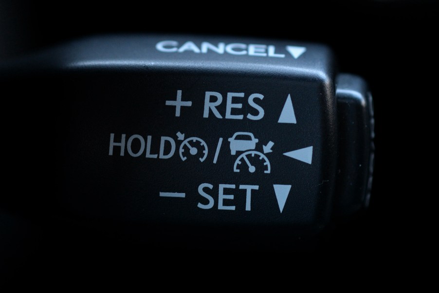 A close-up of a black cruise control stalk in a 2016 Lexus RX 350 SUV