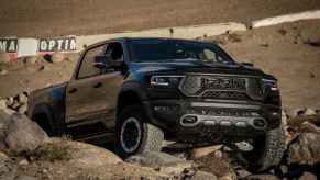 A black 2021 Ram 1500 TRX climbing over rocks