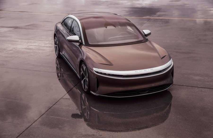 A brown Lucid Air electric car parked on concrete