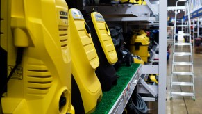 Yellow shop vacs on a shelf in a store