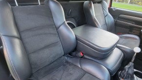 The black-leather sport seats and center console of a 2004 Dodge Ram SRT-10