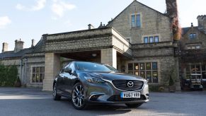 The 2017 Mazda6 2.2 sedan diesel model parked in front of an old brick building