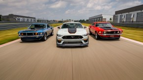 After a 17-year hiatus, the 2021 Mustang Mach 1 fastback coupe (center) made its world premiere