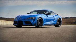 A blue Toyota Supra on a race track