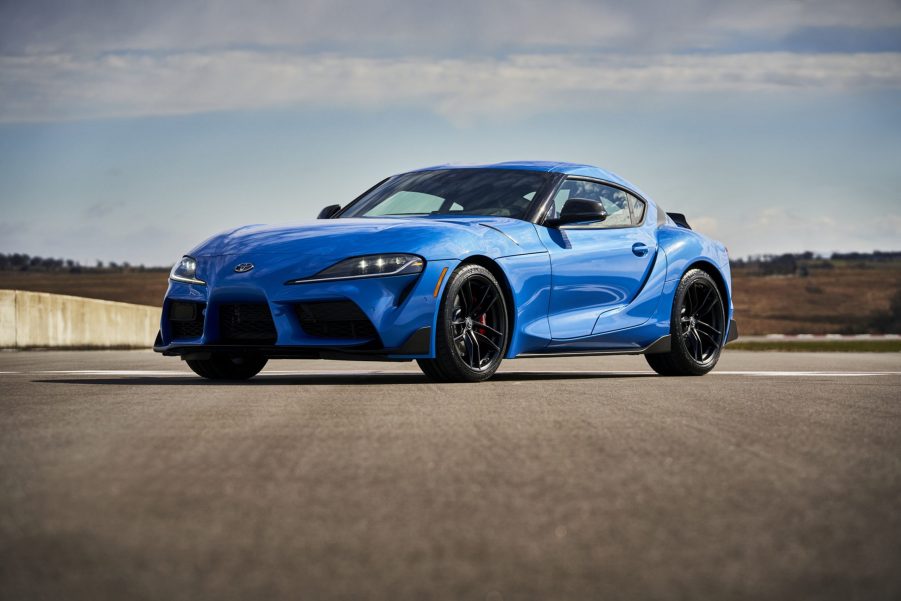 A blue Toyota Supra on a race track