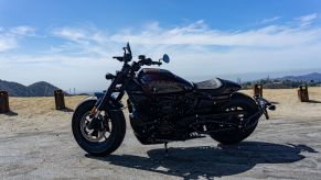 A maroon 2021 Harley-Davidson Sportster S parked on the side of an Angeles Crest Highway hill