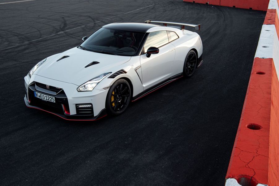 A white 2021 Nissan GT-R is parked on a race track.