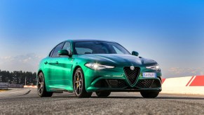 Press photo of a green 2021 Alfa Romeo Giulia, one of car and drivers most beautiful sedans of 2021