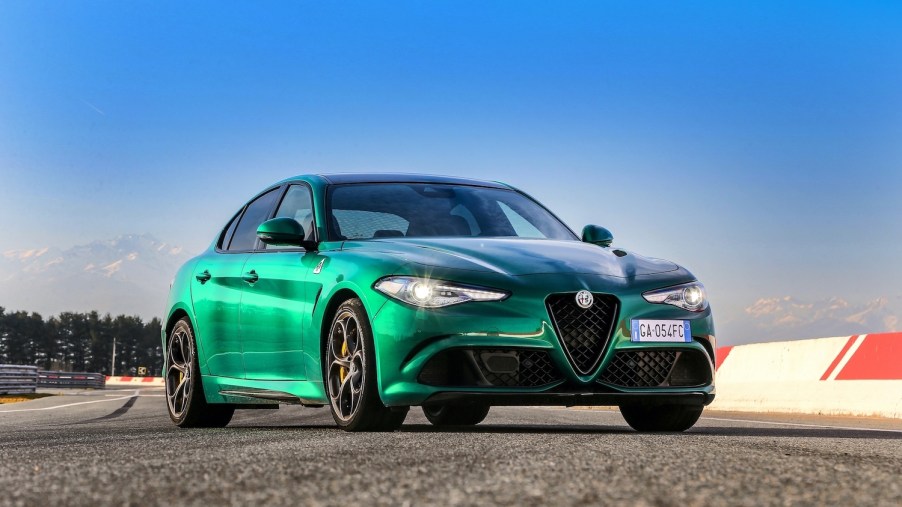 Press photo of a green 2021 Alfa Romeo Giulia, one of car and drivers most beautiful sedans of 2021