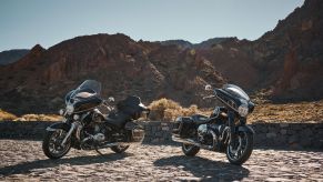 A black-and-chrome 2022 BMW R 18 Transcontinental (left) and R 18 B in the desert