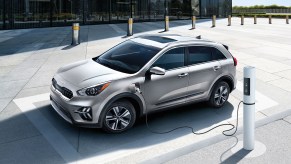 A grey 2022 Kia Niro Plug-In Hybrid being charged.