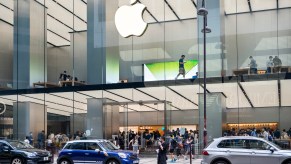 The Apple logo on a glass-walled Apple store in Hong Kong