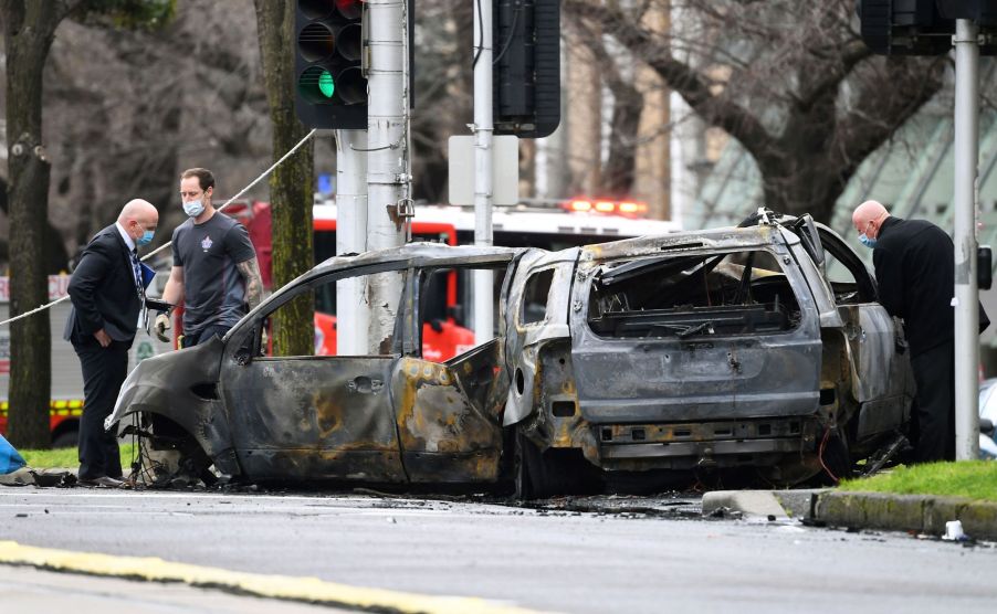 A two vehicle car crash in need of car insurance repair in a city area.