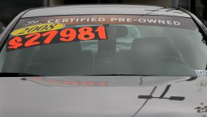 A price sticker on an Infiniti model in a user car lot in San Rafael, California