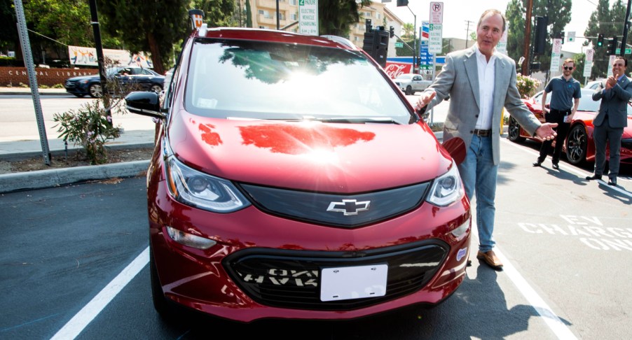 Congressman Adam Schiff plugs in his Chevy Bolt during the unveiling of new electric vehicle charging ports in Downtown Burbank on Monday, July 12, 2021.