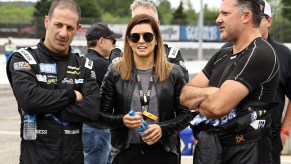 CBS driver analyst Danica Patrick talks with SRX drivers Tony Kanaan (left) and Tony Stewart on the grid prior to the Inaugural Superstar Racing Experience Event at Stafford Motor Speedway on June 12, 2021, in Stafford Springs, Connecticut. Patrick is one of few women in motorsports.