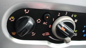 Manual air conditioning (AC) switch in Dacia Sandero car is seen in Gdansk, Poland on 9 July 2019 .