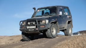 A modified off-road SUV on a trail