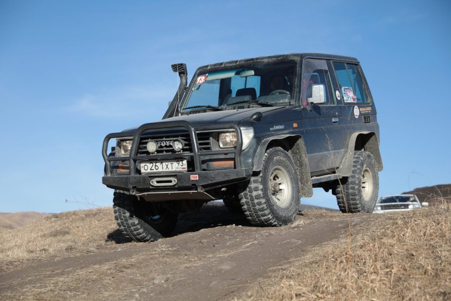 A modified off-road SUV on a trail