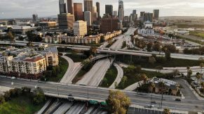 A highway in Los Angeles with the city skyline in the background