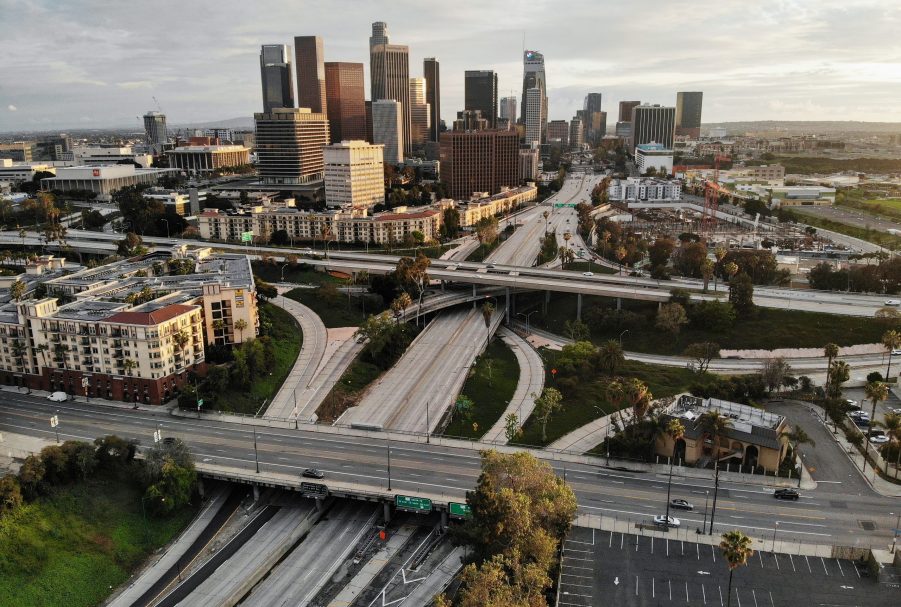 A highway in Los Angeles with the city skyline in the background