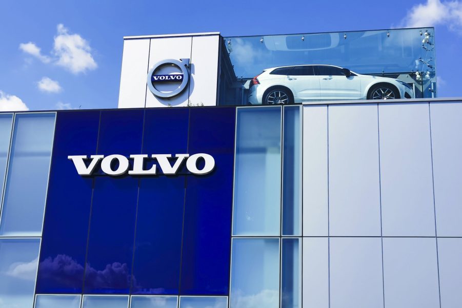 a Volvo building with the logo and a display car