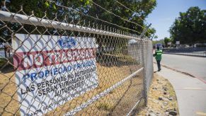 A "No Trespassing" sign outside a Ford plant