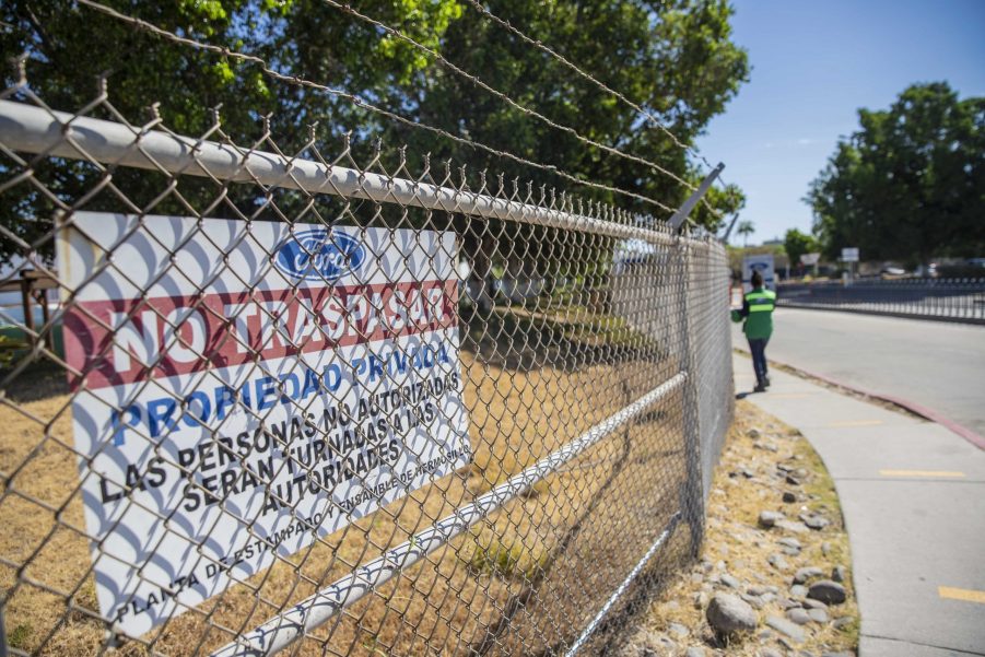 A "No Trespassing" sign outside a Ford plant