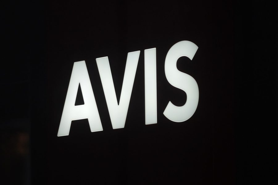 A white Avis logo over a black background