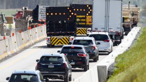 Cars merge down to a single lane as they approach roadwork