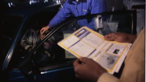 CarMax Salesman Handing Car Keys to Woman