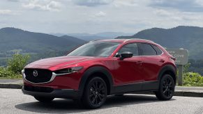 The 2021 Mazda CX-30 Turbo parked in front of a mountain view