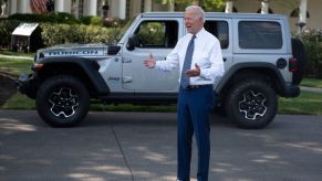 President Joe Biden speaking to reporters outside of the White House near a Jeep Wrangler 4xe model