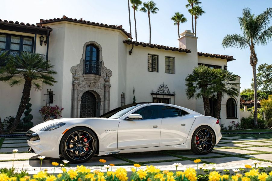 The Karma Revero GT parked in the plaza outside of a luxury villa