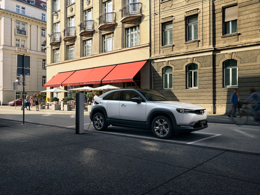 White 2022 Mazda MX-30 charging while parked.