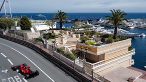 A Ferrari F1 car drives on the Circuit de Monaco race track