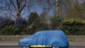 Morris Minor Classic Car Covered By Tarp