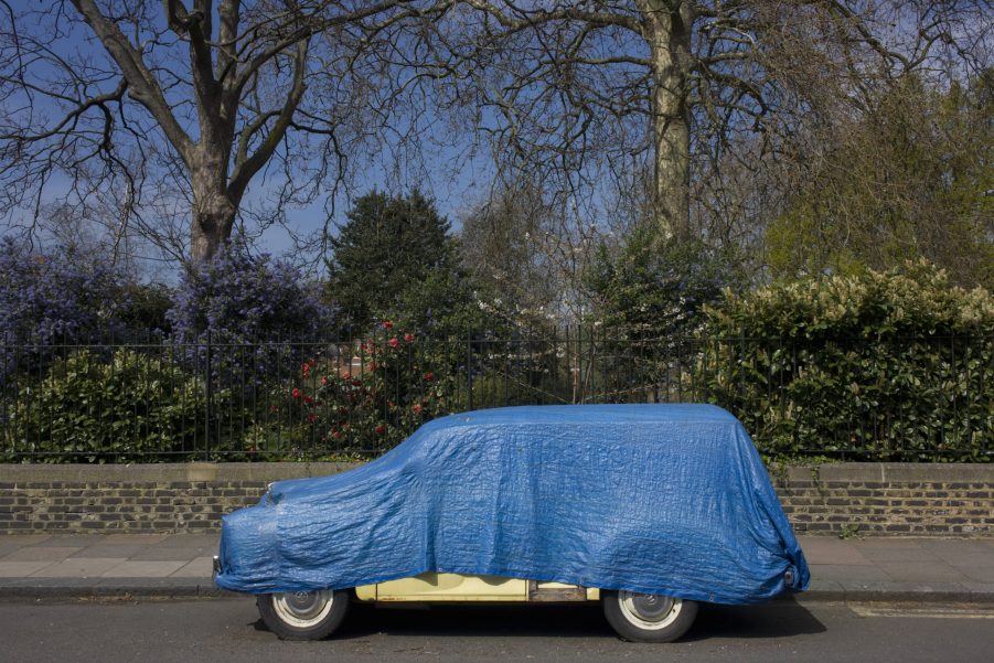 Morris Minor Classic Car Covered By Tarp