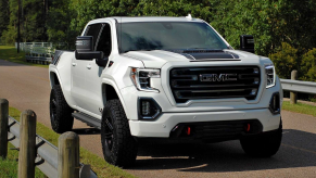 The PaxPower GMC Sierra Jackal on a dirt road