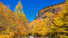 Scenic autumn drive through Smugglers Notch, one of the best scenic drives for leaf-peeping in the northeast