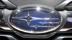 A closeup shot of the Subaru brand logo at the 2018 Geneva Motor Show