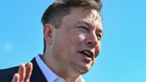 Tesla CEO Elon Musk stands on the construction site of the Tesla Gigafactory near Berlin, Germany, in September 2020