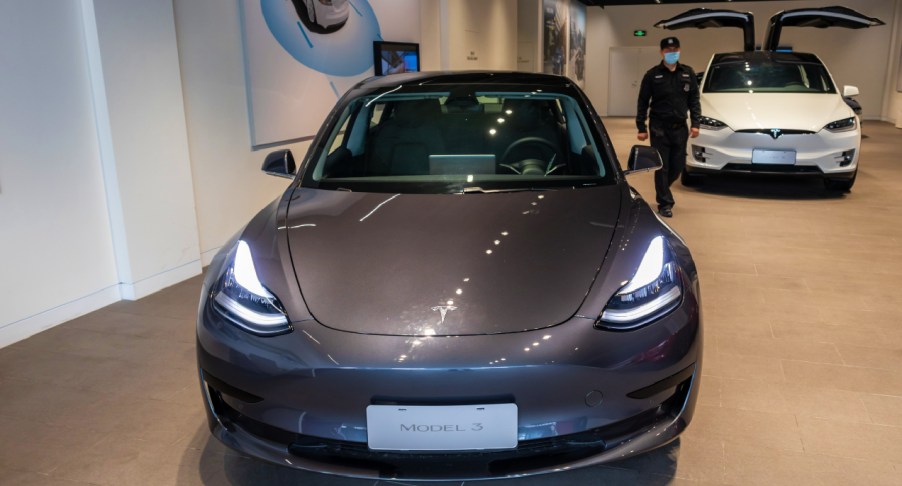 A Tesla Model 3 car and a Tesla Model X vehicle are seen at the first Tesla Center in Shanghai