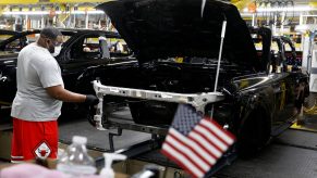 A line worker assembles Ford Motor Company's Ford Bronco on the line at their Michigan Assembly Plant