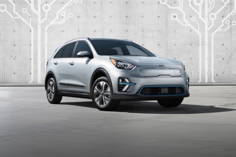 a silver 2021 kia Niro electric in a press photo against a concrete wall