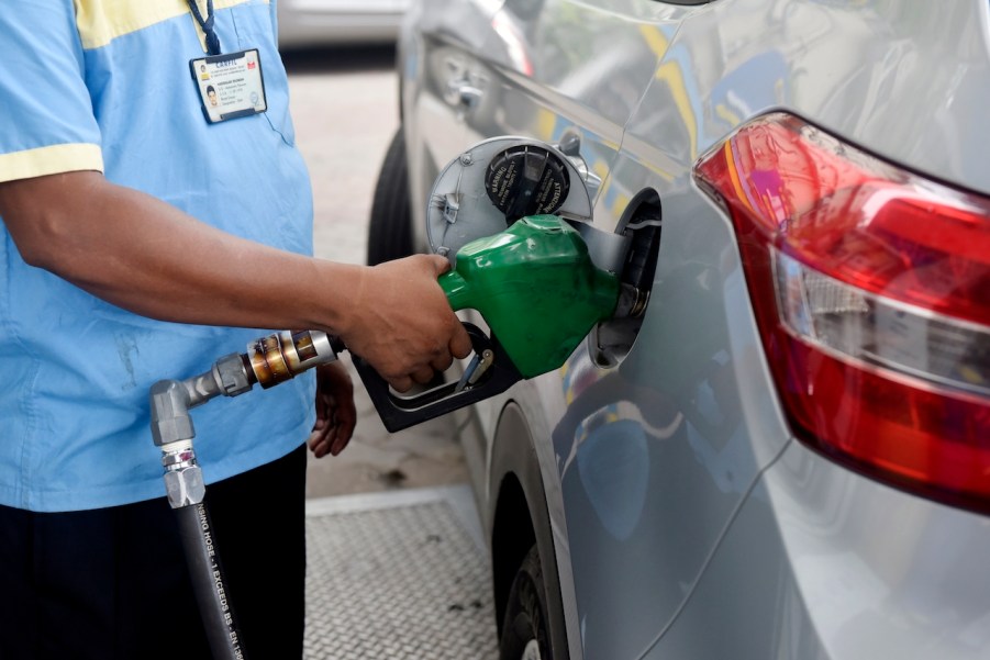 A man pumping gas