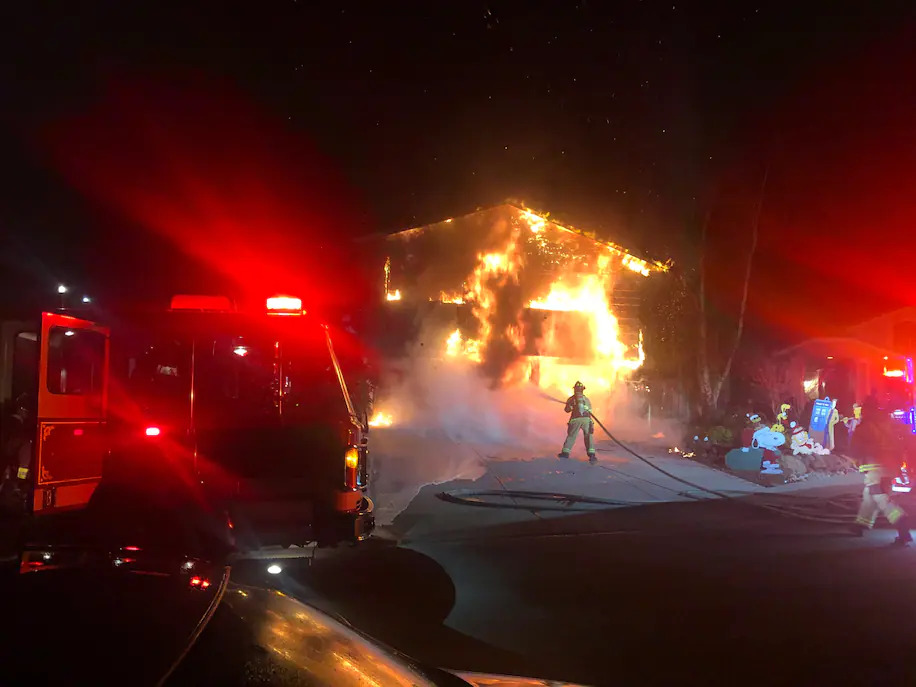 The Vindum family's home engulfed in flames